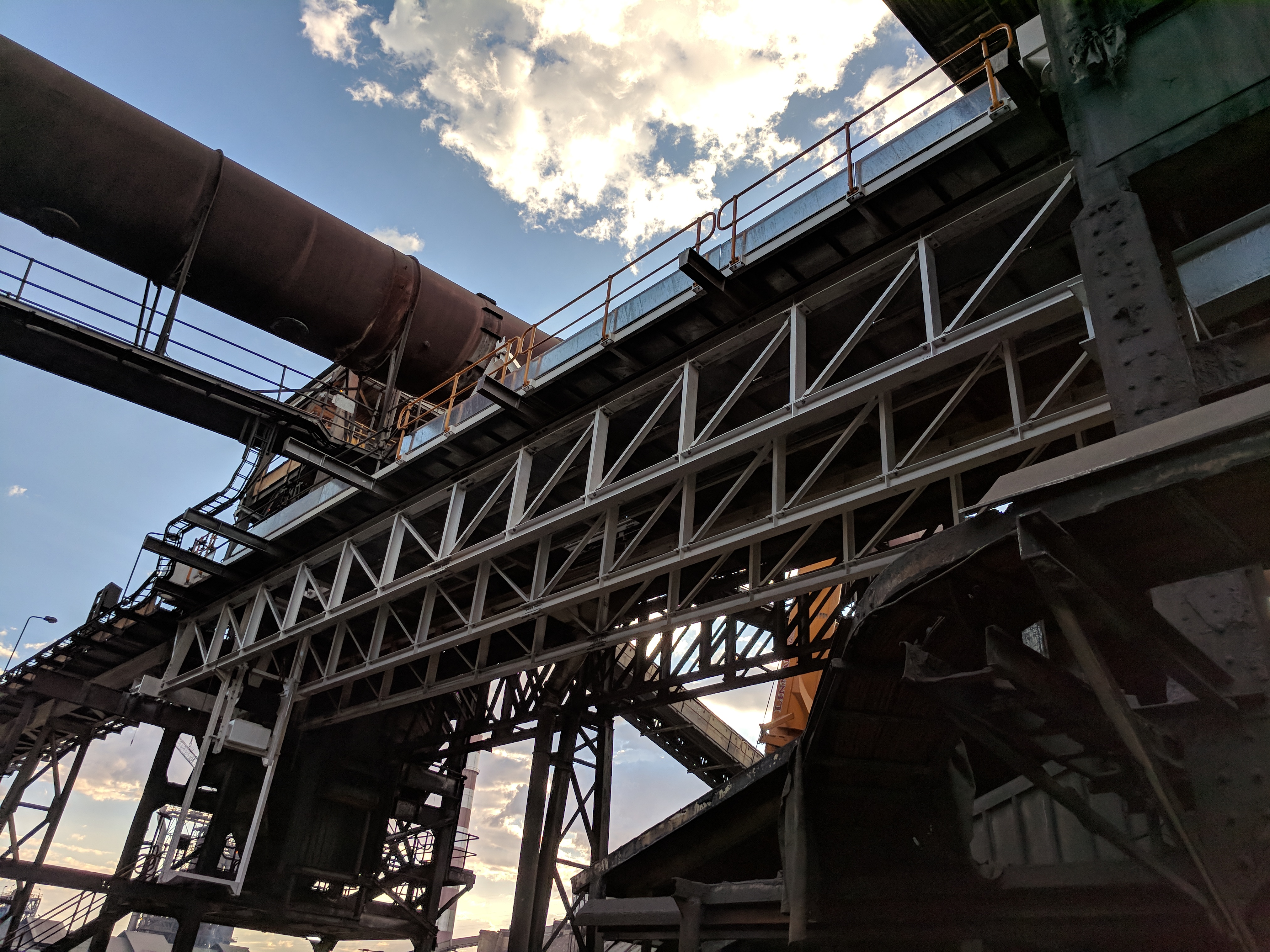 New conveyor truss structure against sunset sky